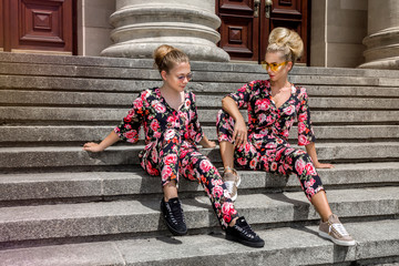 Mother and daughter having fun in same outfits. Fashionable family - Image