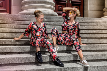 Mother and daughter having fun in same outfits. Fashionable family - Image