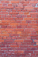 Red bricks background. A part of wall of the building