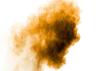 Orange color powder explosion on white background. Orange color dust splash.