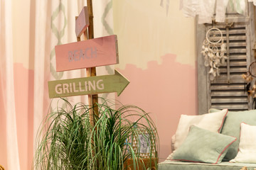 Wooden signpost in furniture display room