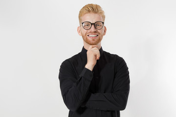 Happy Stylish guy in black shirt and glasses. Folded arms, copy space. Successful young,...