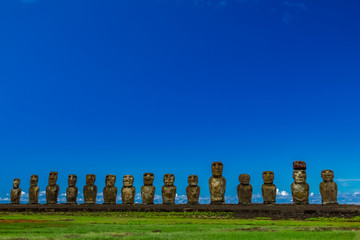 Moai statues of Ahu Tongariki under clear blue sky on Easter Island