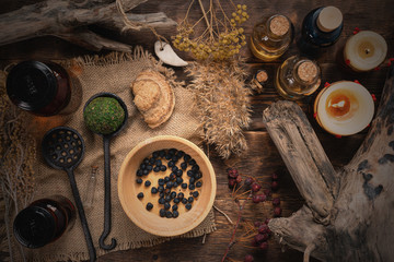 Herbal medicine with dried ingredients background. Witch doctor concept.