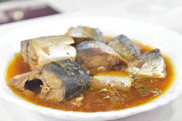 canned fish in tomato sauce.