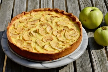 Freshly baked French apple pie with a crunchy bottom and  freshly picked apples