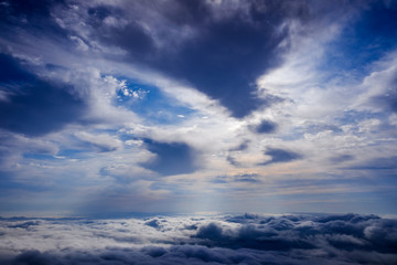 Fototapeta na wymiar Scene of a winter cloudy sky from the top of a mountain peak.