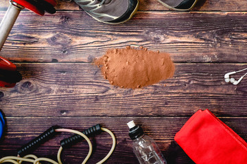 Sports supplement based on whey, protein and carbohydrates with cocoa flavor, background with...