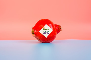 A fruit with a warning sticker for dangerous chemicals.