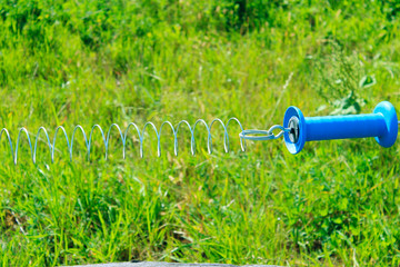 Electric shepherd, close-up. Stable, fencing, fence, cropped shot. Fence in the stable.