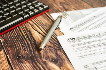 Form 1040 of American taxes on a taxpayer's desk.