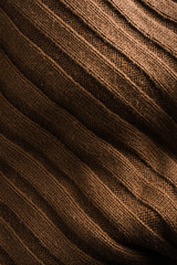 Fabric brown gold background texture light and shadow flat lay with copy space for text