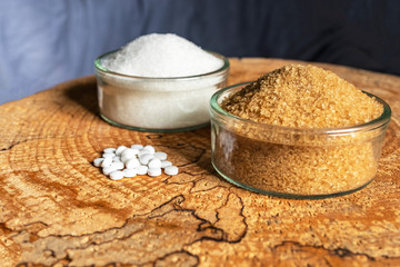 Sugar white and cane or sugar substitute. Question mark what to choose. The hopeful background. View from above.