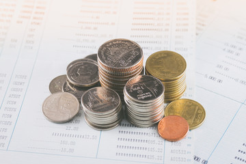 Stack of money coin on bookbank concept saving money