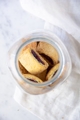 top view of jar filled with newtons cookies stuffed with jam