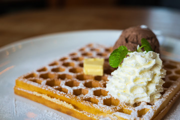 chocolate ice cream, soft cream, cheese on waffle in the white plate