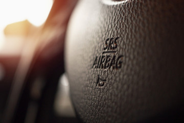 Safety airbag sign on car steering wheel with horn icon