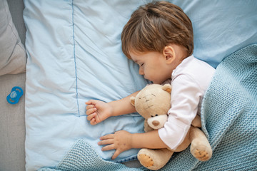 Portrait of cute sleeping boy. Sleeping baby happy and carefree. Concept of house and home. Happy...