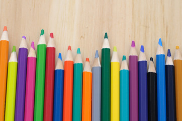 group of drawing color pencils on wooden background
