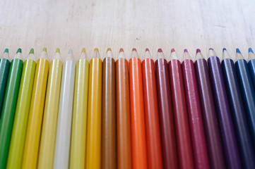 group of drawing color pencils on wooden background