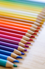 group of drawing color pencils on wooden background