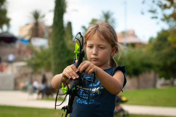 little girl in the Park launches drones