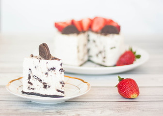Creamy Oreo cheesecake with strawberries on a plate