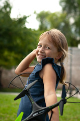 little girl in the Park launches drones