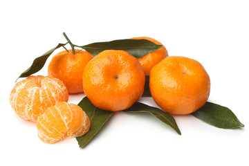 Ripe tangerines with green leaves