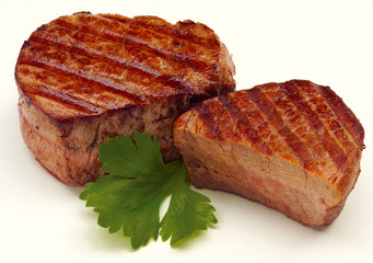 Cooked Fillet Steak Medallions on white background