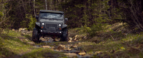 Obraz na płótnie Canvas off-road extreme expedition on black SUV