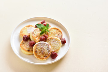 Cottage cheese pancakes with fresh raspberries