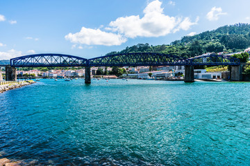 Obraz premium iron bridge for railroad crossing the sea to the other side of the bay