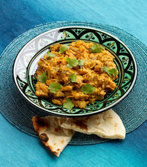 Creamy Aubergine Bharta, plated with nan bread
