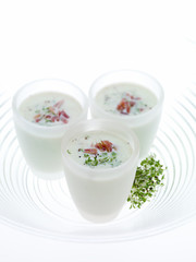 Bacon and Cress soups shots on blowing white background