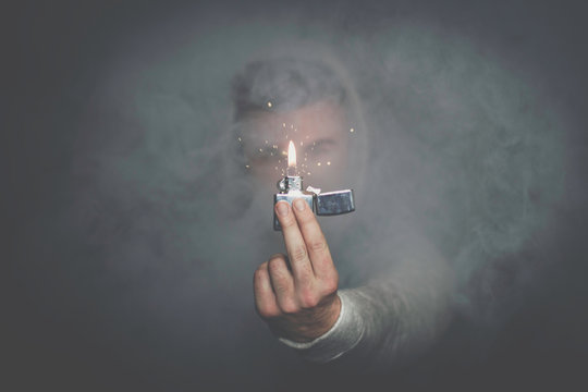A man who flicked a bic through a haze.