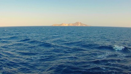 view of the island from the porthole cruise ship