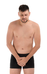 Fototapeta premium Man suffering from pain on white background. Urology problems