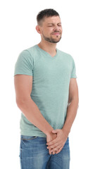 Obraz premium Man suffering from pain on white background. Urology problems