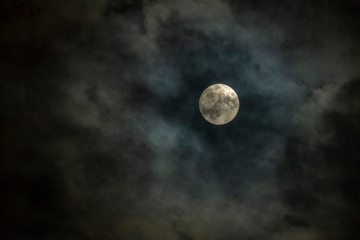 Naklejka na ściany i meble Full moon in cloudy night sky