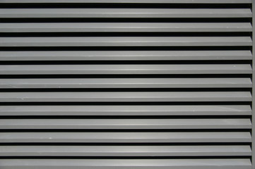 gray background texture. horizontal metal stripes in gray