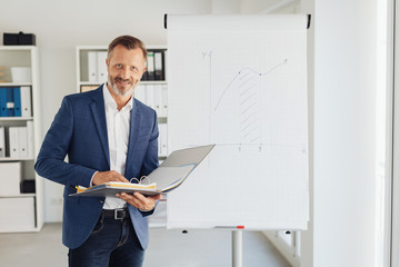 Attractive stylish businessman doing presentation
