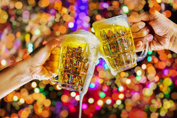 Celebration with a beer mug background bokeh is a concept of celebration and social gatherings.