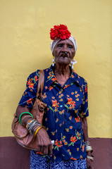Old Cuban lady smoking a large cigar in La Havana, Cuba
