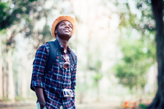 Smiling young man with camera