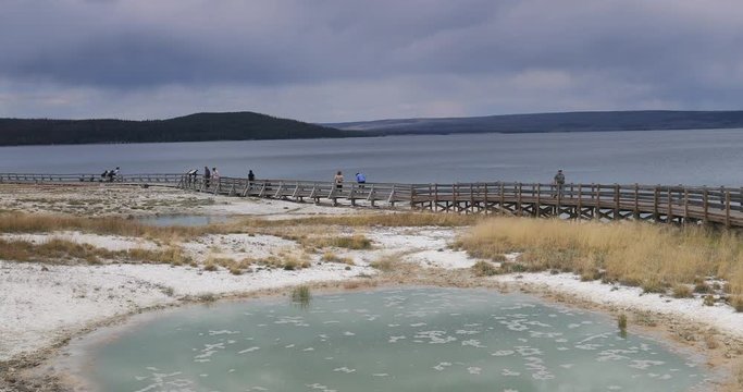 Yellowstone Lake Shore boardwalk West Thumb Geyser Basin. Geyser Yellowstone National Park in Wyoming, United States. Highly predictable geothermal ecosystem feature.