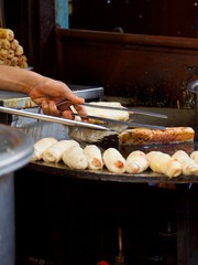 outdoor cooking at food stall 