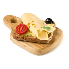Open  faced cheese sandwich canape or crostini on a wooden serving board  isolated on white background closeup.  Vegetarian tartarine.