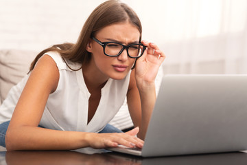 Girl Looking At Laptop Having Eyesight Problem At Home - obrazy, fototapety, plakaty