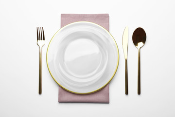 Elegant table setting on white background, top view